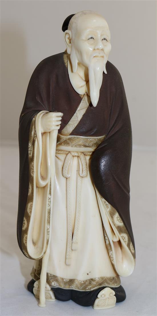 A Japanese ivory figure of a Chinese sage, Taisho period, 18.5cm, loss to staff